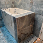 Bathtub with tile walls